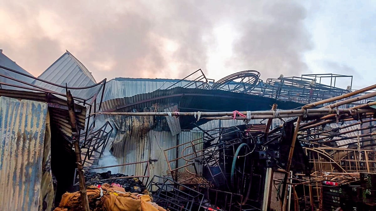 PTI : Smoke out after a fire broke out in four tent godowns in south Delhi's Jaunapur area, in the early hours of Tuesday